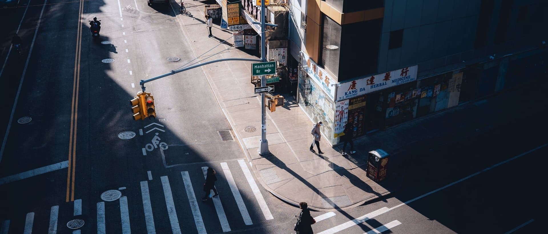 Aerial view of a Manhattan crosswalk and street architecture in morning light